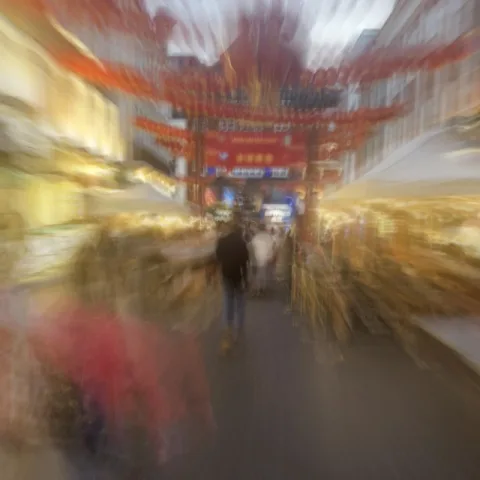 Cover artwork for Lately (Chinatown Version), a blurred figure walking towards a Chinatown gate